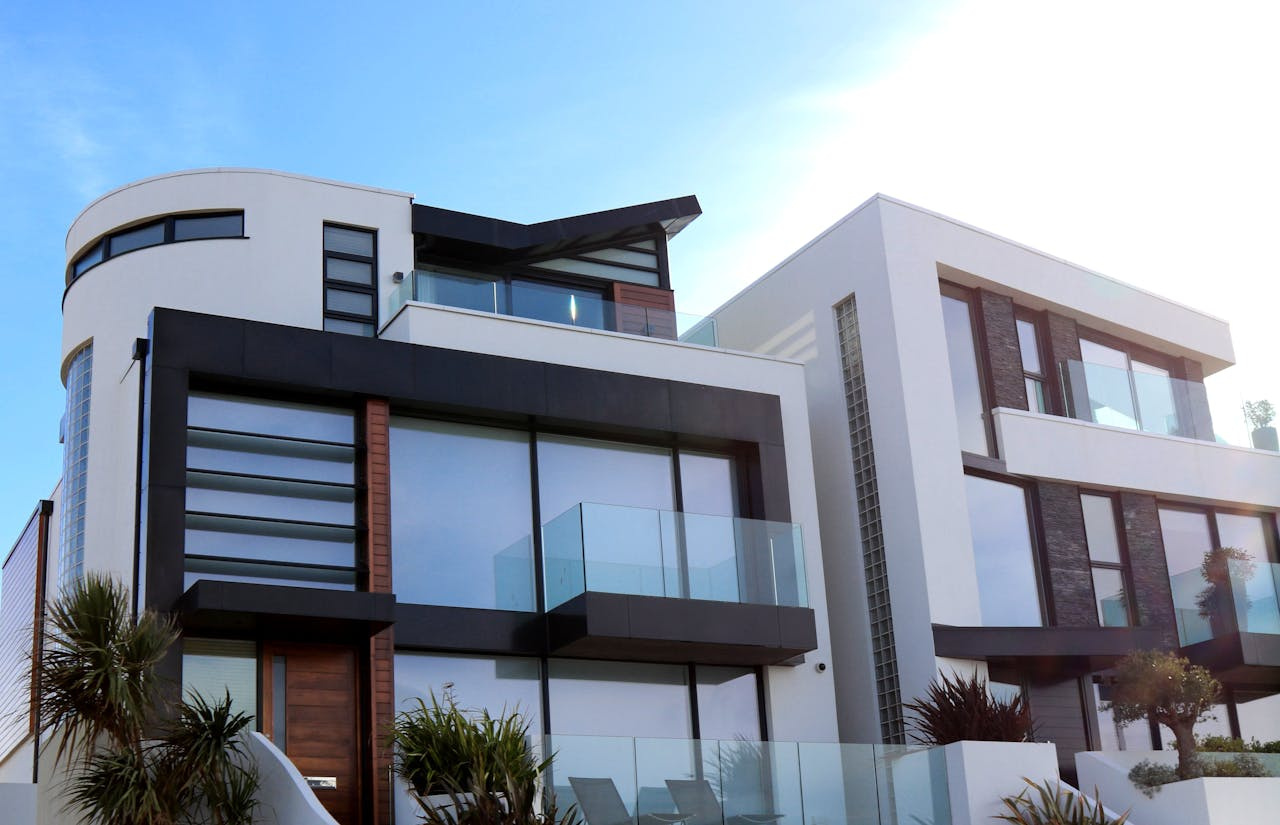 A modern luxury house in the Philippines with sleek architecture, large glass windows, and contemporary design elements.